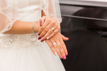 Hands of a bride with wedding ring