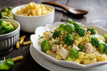 Pasta salad with chicken meat, broccoli, cheese and basil