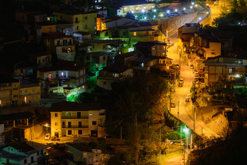 Lighted street at night in Italy. Panoramic view with lighted st