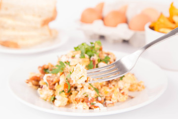 Scrambled eggs with chanterelle and parsley