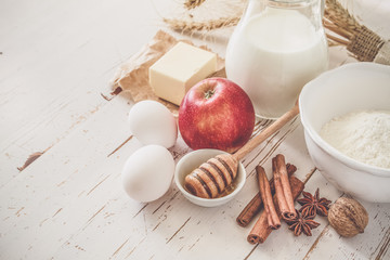 Fototapeta na wymiar Ingredients for baking - milk, butter, eggs, flour, wheat