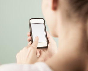 Closeup of girl using blank smartphone. 