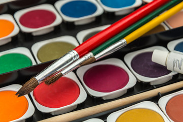 watercolor paints and brushes