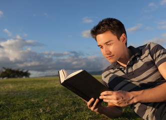 Young man reading the bible. 