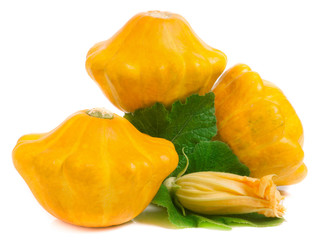 three yellow pattypan squash with leaf and flower isolated on white background