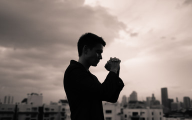 Desperate in the city with hands folded. Prayer and  religion concept.  © kieferpix