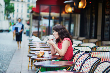Woman drinking coffee in cafe
