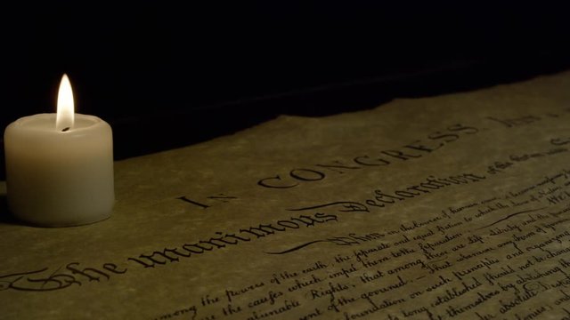 Declaration of Independence by candle light