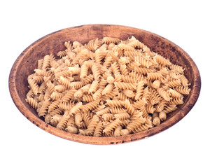 Organic italian rice pasta in wooden bowl