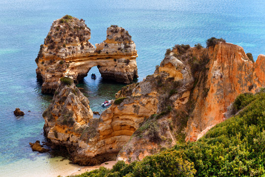 Arch of cliffs on Praia do Camilo beach, Algarve, Portugal