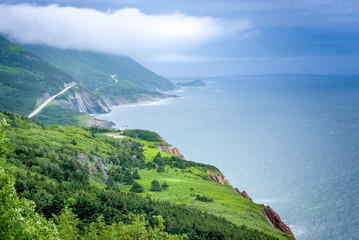 scenic  green lands and road of Cape Breton, Nova Scotia, Canada