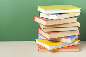 Stack of colorful books. Education background. Back to school. Copy space for text.