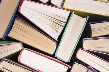 Open book, hardback books on wooden table. Education background. Back to school. Copy space for text.