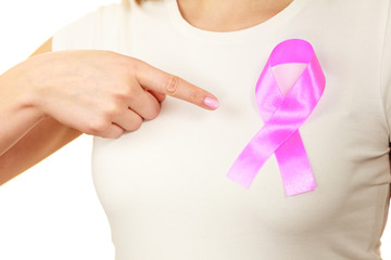 Closeup pink cancer ribbon on woman chest