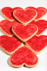 Fototapeta na wymiar heart shaped cookies, arranged for Valentine's Day, close up, isolated, vertical