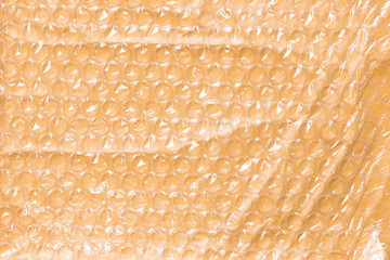 inside texture of a padded, yellow mailing envelope with bubbles