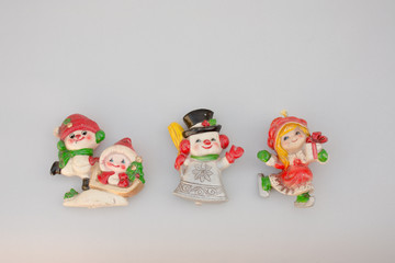 Fototapeta na wymiar Christmas ornament figurines on a light background