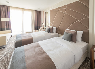 Modern hotel room with big bed