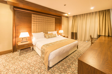 Modern hotel room with big bed