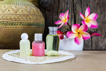 Mini set of shampoo or shower bath and flowers in boutique style