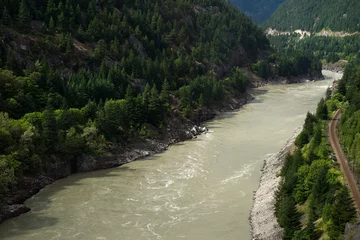 Tuinposter Pacific Canadian Railway and Hells Gate, abrupt narrowing of British Columbia's Fraser River, located downstream of Boston Bar in the southern Fraser Canyon © misszin