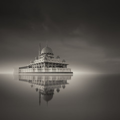 Putra Mosque, Putrajaya Malaysia in brown monochrome long exposure fine art reflection on the lake surface with grain effect.