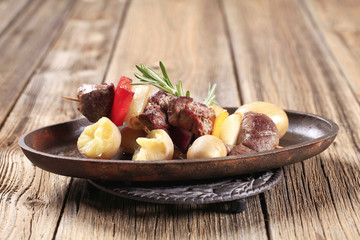 Beef shish kebab and new potatoes