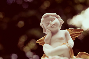 Cute angelic cupid statue,  valentine day or wedding, marry concept - vintage tone