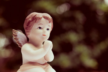 Angelic cupid statue,  valentine day or wedding, marry concept - vintage tone