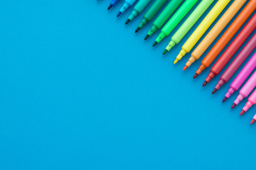 Colorful pen on blue background with copy space - Creative idea and education concept.