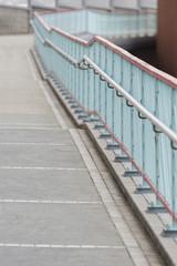 empty pedestrian walkway with bannister