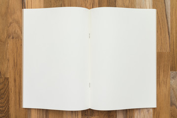 Blank empty notepad on wooden table background - Business and education concept.