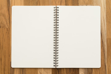 Blank empty notepad on wooden table background - Business and education concept.