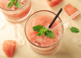 Healthy watermelon smoothie with mint and ice in glass