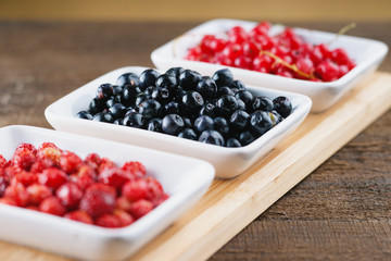 Berry fruits in a dishes