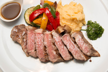 Beef steak with sauce as closeup