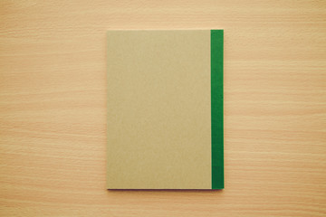 Blank empty notepad on wooden table background - Business and education concept.