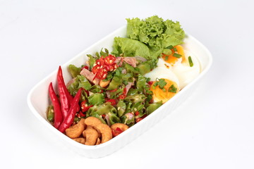 Spicy sour sausage salad on white background.