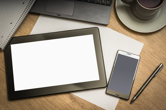 Digital tablet on business table with blank white screen
