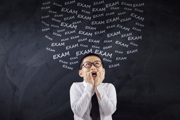 Frustrated boy thinking his exam