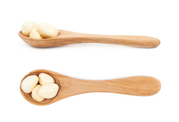 Spoon of chocolate candies isolated