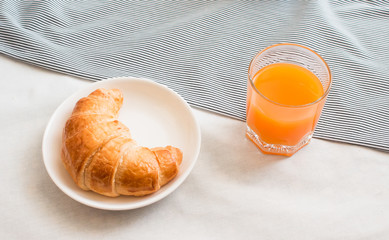 Orange juice and croissant