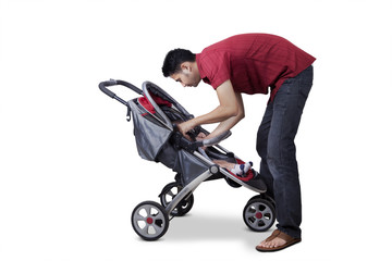Man and his son inside a stroller