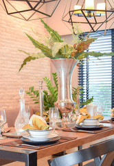 elegant table set in modern style dining room interior