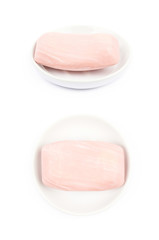 Pink soap over the plate isolated