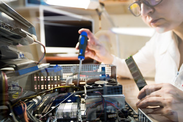 Computer Technician repairing Hardware throw the window image