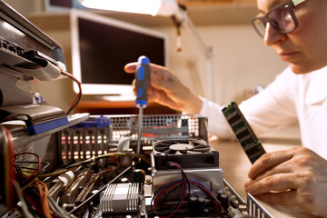 Computer Technician repairing Hardware with tools