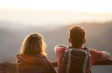 Couple Watching Sunset Mountain Outdoors Concept