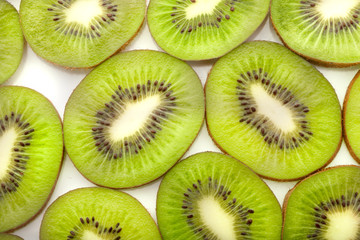 Fototapeta premium Slice of fresh kiwi fruit isolated on white background