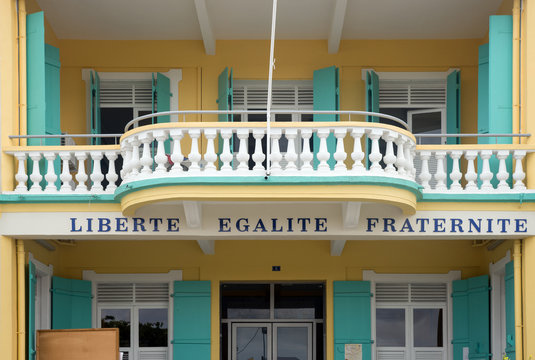 Words in French, Liberte, Egalite, Fraternite under a balcony